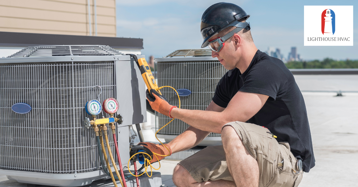 HVAC maintenance guy working on unit Lighthouse HVAC